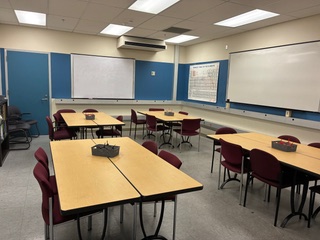 Classroom with whiteboard and 4 tables